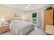 Bright bedroom with a cozy bed, natural light, and serene decor at 7164 Moss Point Dr, Charlotte, NC 28277