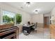 Bright office featuring a desk, piano, and large window providing natural light at 7164 Moss Point Dr, Charlotte, NC 28277