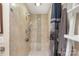 Close-up of the shower featuring tiled walls, a built-in bench, and modern fixtures at 7164 Moss Point Dr, Charlotte, NC 28277