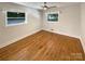Bedroom featuring hardwood floors and natural light from large windows at 7812 Old Concord Rd, Salisbury, NC 28146