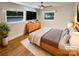 Bright bedroom with hardwood floors, ceiling fan, and natural light at 7812 Old Concord Rd, Salisbury, NC 28146