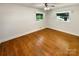 Bright bedroom featuring hardwood floors and two large windows at 7812 Old Concord Rd, Salisbury, NC 28146