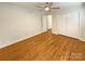 Bedroom with hardwood floors, ceiling fan, and ample closet space at 7812 Old Concord Rd, Salisbury, NC 28146