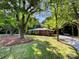 Charming brick home with a manicured lawn and mature trees at 7812 Old Concord Rd, Salisbury, NC 28146