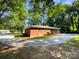 Brick home with a stone driveway and mature trees at 7812 Old Concord Rd, Salisbury, NC 28146