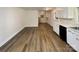 Kitchen with white cabinets, appliances, and light vinyl floors at 7812 Old Concord Rd, Salisbury, NC 28146