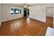 Bright living room with hardwood floors, large windows, and a ceiling fan at 7812 Old Concord Rd, Salisbury, NC 28146