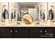 Elegant bathroom with a double sink vanity, decorative vase, and modern fixtures at 8388 Waxhaw Hwy, Waxhaw, NC 28173