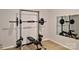 A home gym area featuring a weight rack, bench, and mirror for fitness enthusiasts at 8388 Waxhaw Hwy, Waxhaw, NC 28173