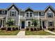 Charming townhome featuring a well-maintained front yard with lush landscaping and a welcoming entrance at 8388 Waxhaw Hwy, Waxhaw, NC 28173