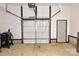Spacious garage with a white garage door, and side door, ready for your vehicles and projects at 8388 Waxhaw Hwy, Waxhaw, NC 28173