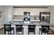Modern kitchen boasts granite countertops, stainless steel appliances, and a large island with seating at 8388 Waxhaw Hwy, Waxhaw, NC 28173