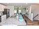 Spacious kitchen with granite island, stainless steel appliances, open to the living area at 8388 Waxhaw Hwy, Waxhaw, NC 28173