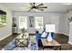 Open living room features hardwood floors, elegant decor, and plenty of natural light at 8388 Waxhaw Hwy, Waxhaw, NC 28173