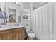Updated bathroom with modern vanity, tiled shower, and natural light at 9801 Blackbird Hill Ln, Mint Hill, NC 28227