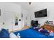 A bedroom with a desk and a cozy bed for a relaxing and functional space at 9801 Blackbird Hill Ln, Mint Hill, NC 28227
