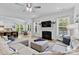 Open living area flows into kitchen and dining, filled with natural light at 9801 Blackbird Hill Ln, Mint Hill, NC 28227