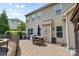Enjoy the outdoor patio area, perfect for al fresco dining and relaxation beside the refreshing pool at 9801 Blackbird Hill Ln, Mint Hill, NC 28227