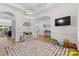 Open concept living space with a playroom, featuring bright light and an open view of the foyer at 9801 Blackbird Hill Ln, Mint Hill, NC 28227