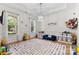 Spacious playroom with a polka dot rug, bright light, and room for to enjoy at 9801 Blackbird Hill Ln, Mint Hill, NC 28227