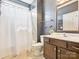 Bathroom with shower and tub, dark paint and vanity with mirror at 1009 Hampton Grove Rd, Waxhaw, NC 28173