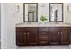 Bright bathroom showcasing a double sink vanity with dark wood cabinets and granite countertops at 1009 Hampton Grove Rd, Waxhaw, NC 28173