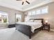 Primary bedroom with trey ceiling, ceiling fan, large windows and carpet at 1009 Hampton Grove Rd, Waxhaw, NC 28173