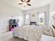 Bright bedroom with large windows, ceiling fan, and plush carpet at 1009 Hampton Grove Rd, Waxhaw, NC 28173