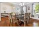Inviting dining room with hardwood floors, neutral walls, and decorative lighting at 1009 Hampton Grove Rd, Waxhaw, NC 28173