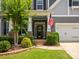 Well-manicured lawn leads up to the front door of the home at 1009 Hampton Grove Rd, Waxhaw, NC 28173