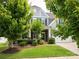 Two-story home with well-manicured lawn and mature trees at 1009 Hampton Grove Rd, Waxhaw, NC 28173