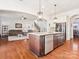 Spacious open kitchen with granite island, stainless appliances and view to main living area at 1009 Hampton Grove Rd, Waxhaw, NC 28173