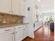 Stylish kitchen featuring white cabinets, granite countertops, a tile backsplash, and hardwood floors at 1009 Hampton Grove Rd, Waxhaw, NC 28173