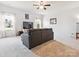 Cozy living room with a gray sofa, carpeted floors, and two large windows offering natural light at 1009 Hampton Grove Rd, Waxhaw, NC 28173