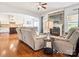 Comfortable living room with a stone fireplace and open view to the kitchen and breakfast nook at 1009 Hampton Grove Rd, Waxhaw, NC 28173