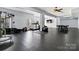 Basement including exercise equipment and open spaces for versatile use at 1009 Murandy Ln, Matthews, NC 28104