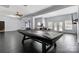 Spacious basement featuring a pool table, exercise equipment and access to the outdoor area at 1009 Murandy Ln, Matthews, NC 28104