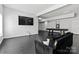 Basement area featuring a sleek TV, comfortable seating, and open layout at 1009 Murandy Ln, Matthews, NC 28104