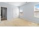 Spacious bedroom with a double closet and large window at 1009 Murandy Ln, Matthews, NC 28104