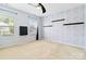 Bright bedroom with neutral walls, ceiling fan, and two windows for natural light at 1009 Murandy Ln, Matthews, NC 28104