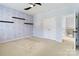 Spacious bedroom featuring ample closet space and a ceiling fan at 1009 Murandy Ln, Matthews, NC 28104