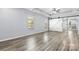 Bedroom with grey wood floors, a ceiling fan and two windows at 1009 Murandy Ln, Matthews, NC 28104
