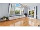 Cozy dining area featuring a large window, window seat, and hardwood flooring at 1009 Murandy Ln, Matthews, NC 28104