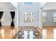 Grand foyer with hardwood floors, decorative tile inlay, and elegant double doors at 1009 Murandy Ln, Matthews, NC 28104