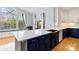 Beautiful kitchen with a large center island, copper sink, quartz countertop, and a window seat at 1009 Murandy Ln, Matthews, NC 28104