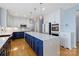 Modern kitchen boasts a center island with quartz countertop and stainless steel appliances at 1009 Murandy Ln, Matthews, NC 28104