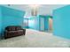 Large living room with blue walls, a couch and window at 1009 Murandy Ln, Matthews, NC 28104