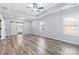 Large main bedroom with walk-in closet, ceiling fan, and grey flooring at 1009 Murandy Ln, Matthews, NC 28104