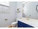Stylish powder room with marble countertop, gold fixtures, and a navy blue vanity at 1009 Murandy Ln, Matthews, NC 28104