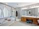 Bright bathroom with soaking tub, glass shower, and double vanity at 1045 Fairway Ridge Nw Rd, Concord, NC 28027